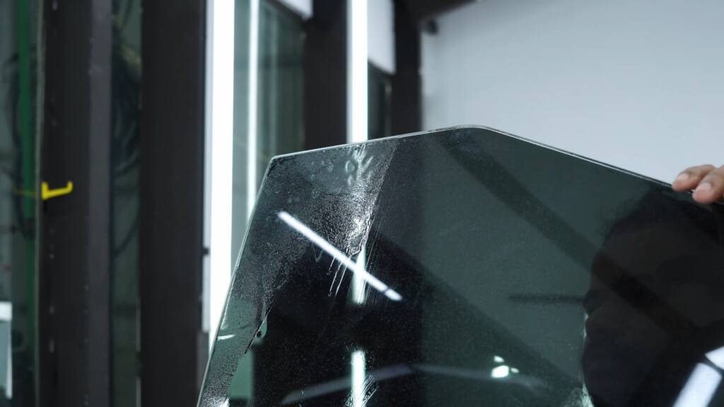 Window tint film laid on Tesla Cybertruck glass