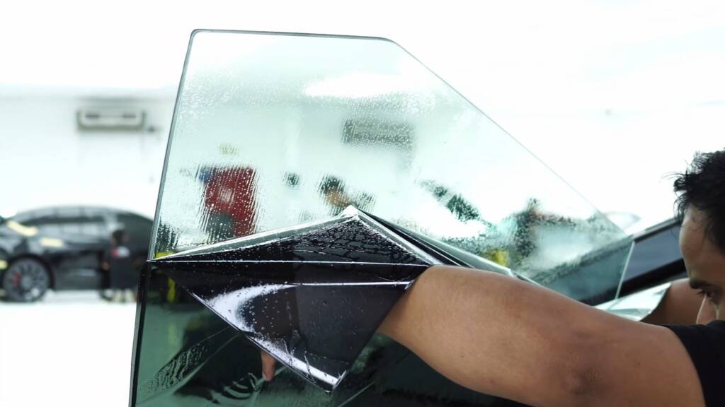 Tesla Cybertruck tint pattern held up to the glass