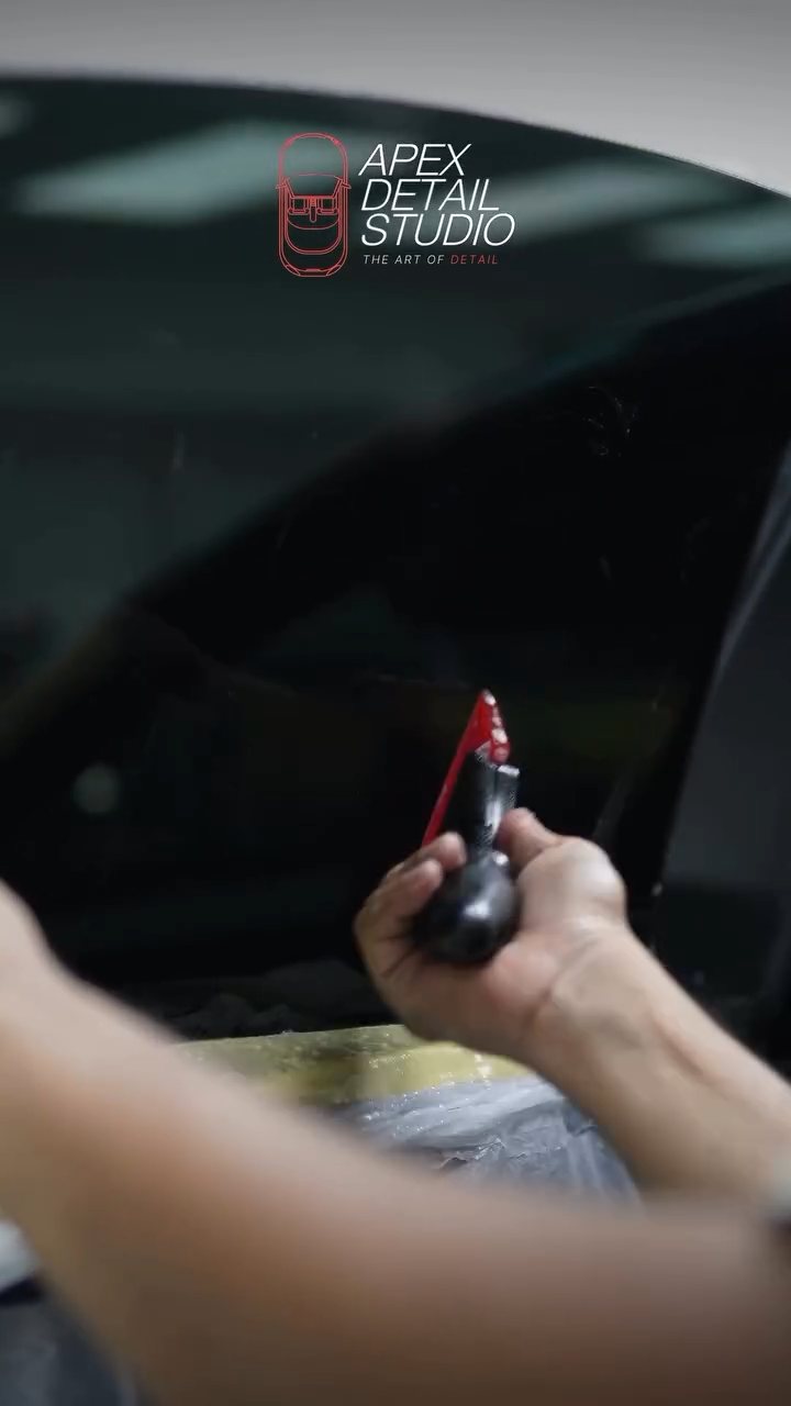 Finishing the Tesla Model 3 window tint edge in Dubai
