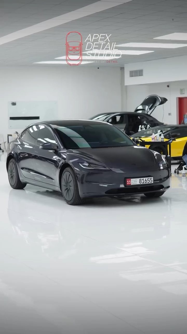 Tesla Model 3 side profile with tinted windows in the Apex studio, Dubai