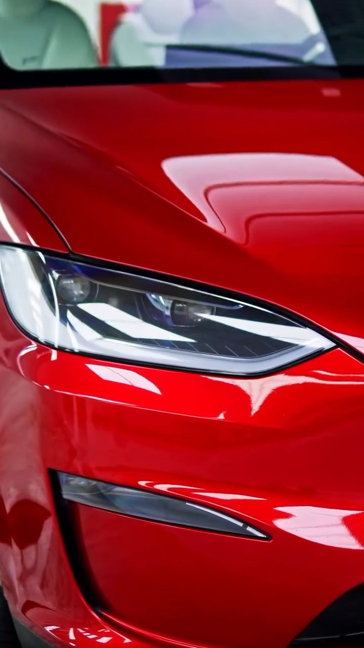 Tesla Model X headlight in red before emerald green colour PPF in Dubai