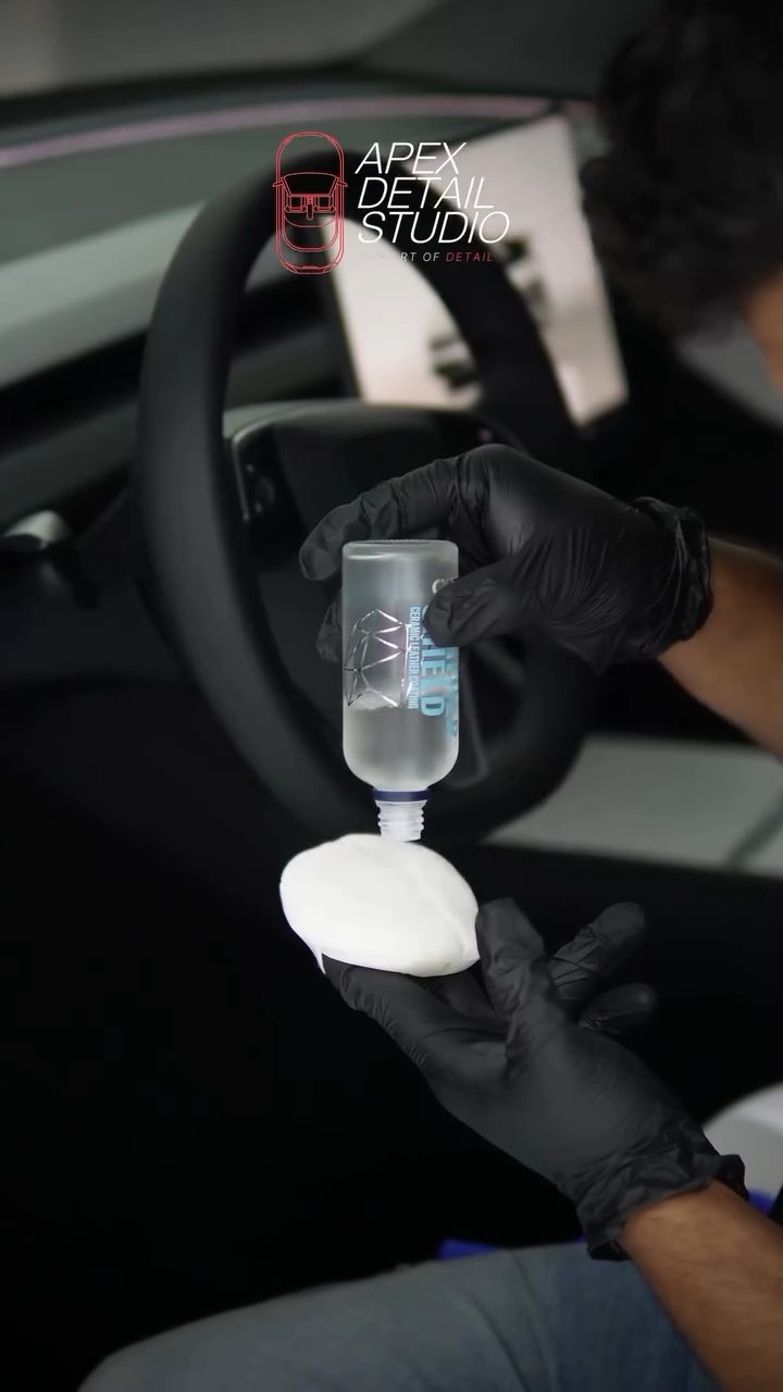Interior ceramic coating loaded onto an applicator for the Tesla Model Y at Apex Detail Studio Dubai
