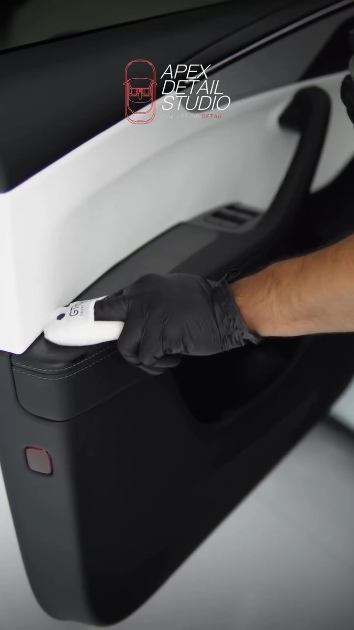 Applying interior ceramic coating to the Tesla Model Y door card in Dubai