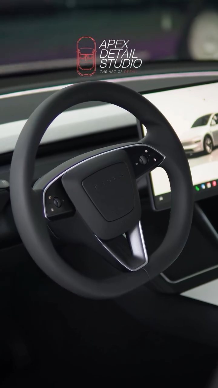 Tesla Model Y steering wheel and screen after interior coating at Apex Detail Studio Dubai