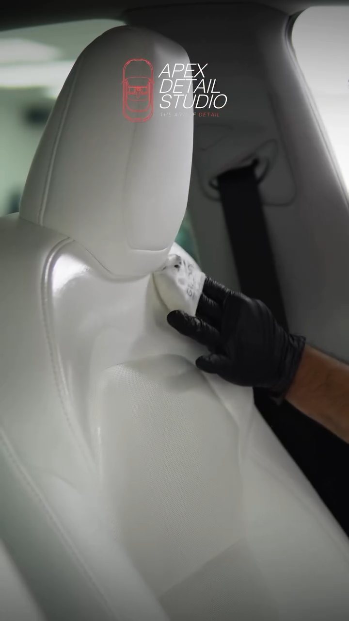 Interior ceramic coating applied to the Tesla Model Y white seat in Dubai