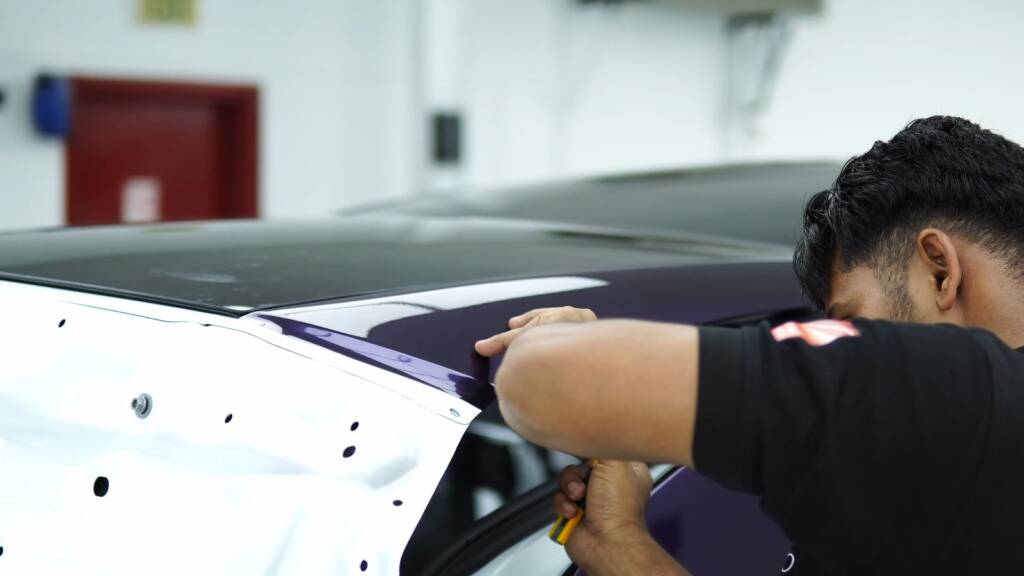 Wrapping the bonnet of a Tesla Model Y Juniper in midnight purple