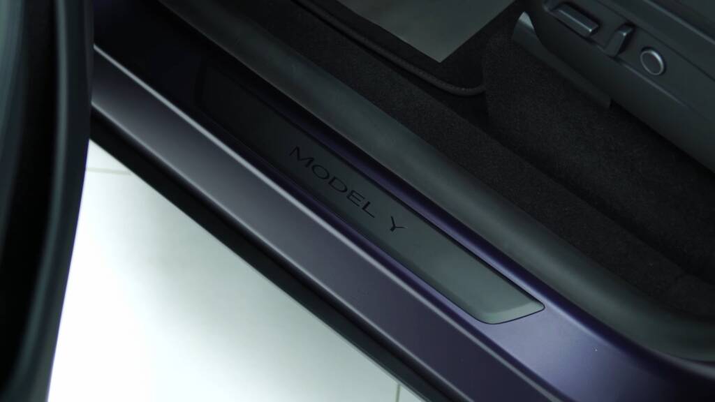 Tesla Model Y Juniper door sill after midnight purple wrap