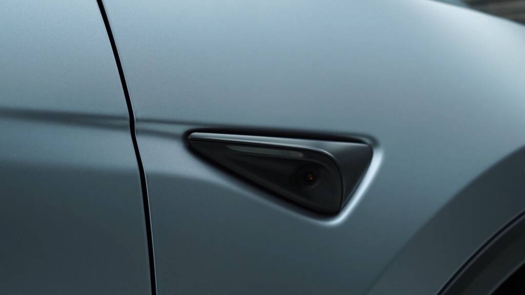 Tesla Model Y Juniper side camera on satin stealth PPF