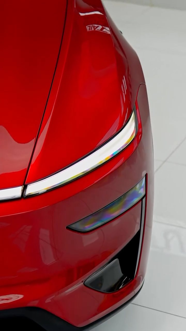 Red Tesla Model Y Performance front light after full PPF in Dubai