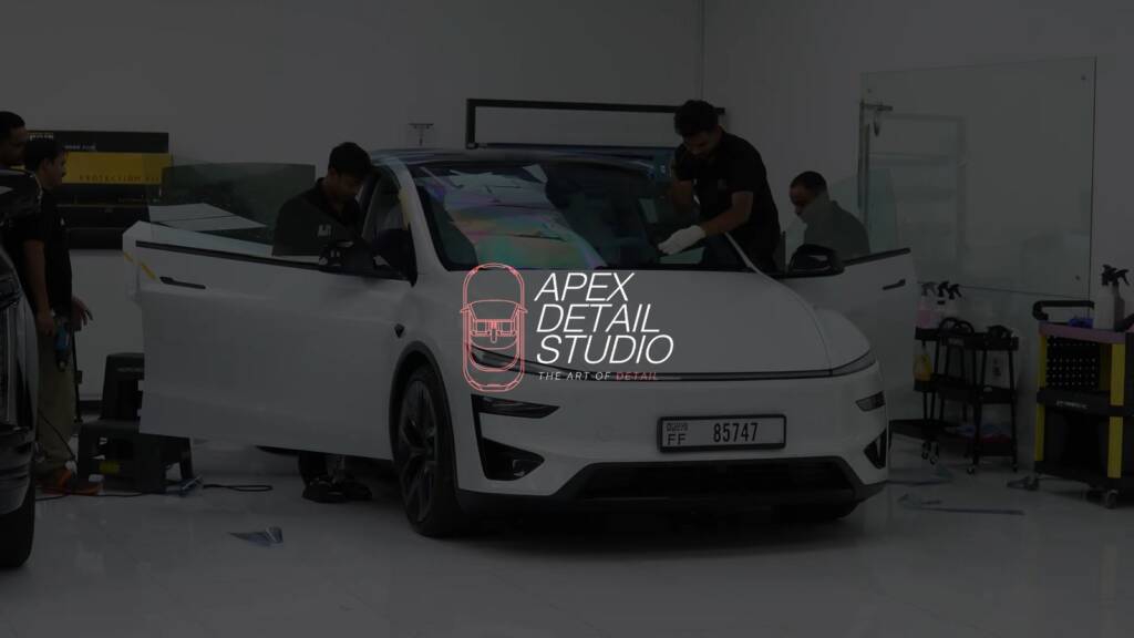 White Tesla Model Y Performance arriving at Apex Detail Studio Dubai before stealth PPF