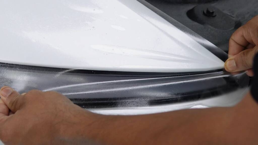 Stealth PPF wrapped under the bonnet edge of a Tesla Model Y Performance