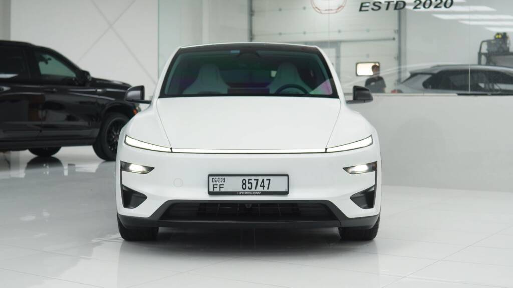 Front view of a white Tesla Model Y Performance after full stealth PPF in Dubai