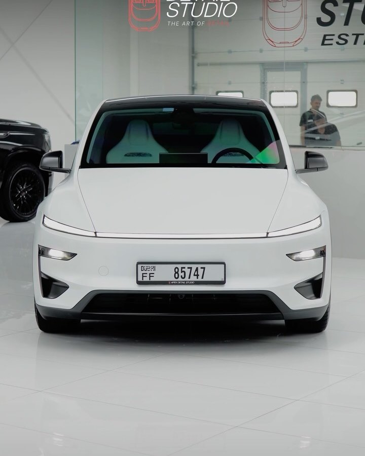 Tesla Model Y Performance, white to satin, full stealth PPF taking the factory gloss to satin, plus window tint, at Apex Detail Studio in Dubai