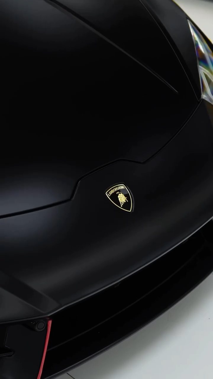 Lamborghini badge on the matte black Huracan bonnet in Dubai