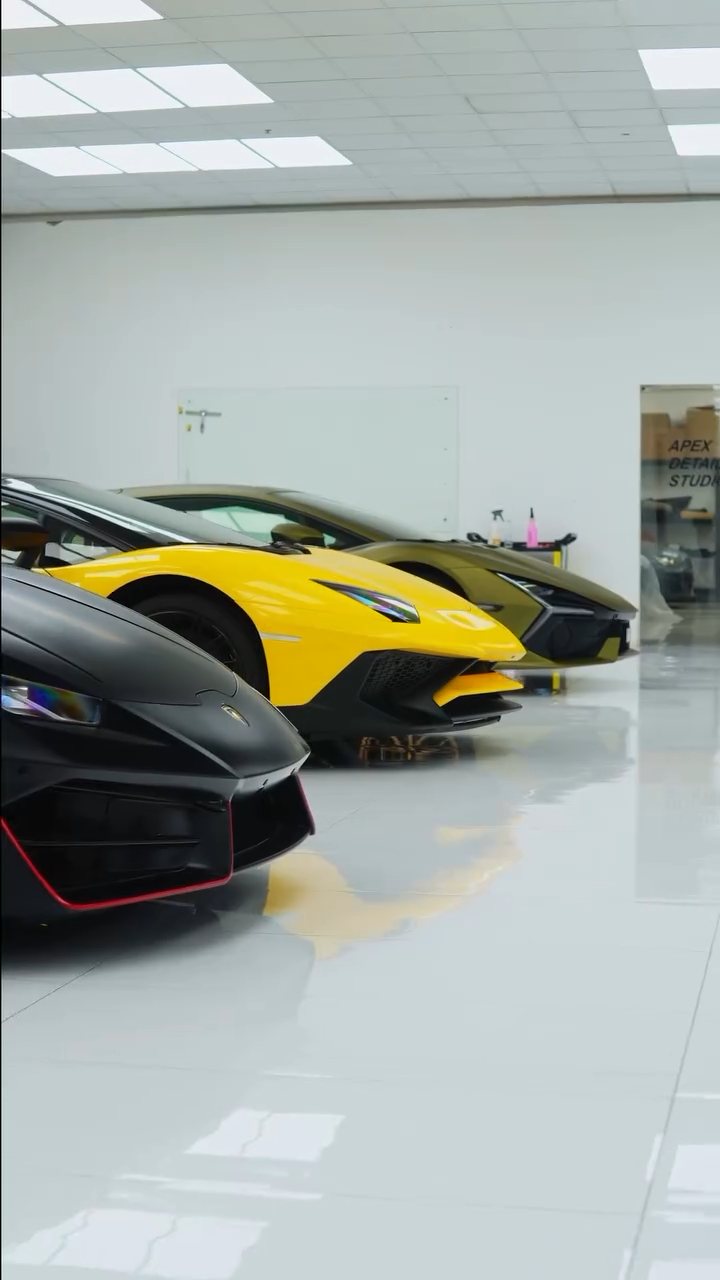 Three Lamborghinis lined up in the Apex Detail Studio showroom in Dubai