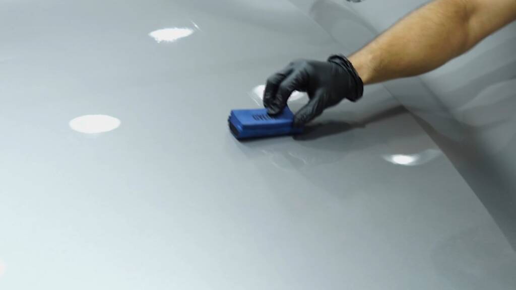 Ceramic coating being applied with an applicator to a Xiaomi YU7 Max
